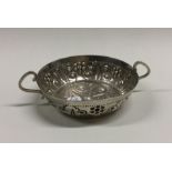 A heavy Victorian chased silver dish with floral d