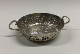 A heavy Victorian chased silver dish with floral d