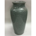 A tall crackleware vase of celadon design. Approx.