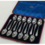 A good set of twelve bright cut silver spoons in f