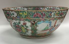 A large Chinese Canton bowl decorated in typical f