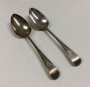 A good pair of George III bright cut silver spoons