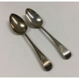 A good pair of George III bright cut silver spoons
