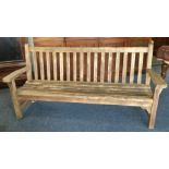 A large teak slat back garden bench. Est. £50 - £8