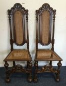 A pair of French cane seated chairs with high back
