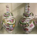 A good pair of large Meissen urns and covers with
