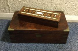 An old rosewood writing slope together with a crib