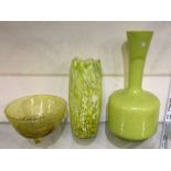 A stylish yellow studio glass bowl together with t