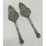 A pair of Continental silver cake servers with flo