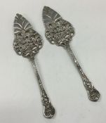 A pair of Continental silver cake servers with flo