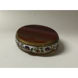 A banded agate and enamel decorated oval pill box.