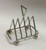 A stylish silver plated toast rack together with s