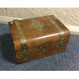 A walnut and brass inlaid box with fitted interior
