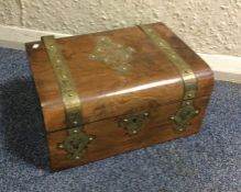 A walnut and brass inlaid box with fitted interior