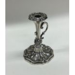 A Victorian silver chamber stick with leaf decorat