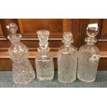 A group of four heavy glass decanters. Est. £20 -
