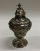 An unusual embossed silver tea caddy decorated wit