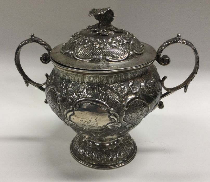 A good George III chased silver cup and cover deco