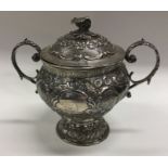 A good George III chased silver cup and cover deco