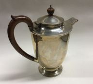 A good large heavy silver water pot of plain form.