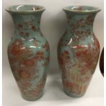 A good pair of Chinese vases decorated with red fl