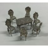 A good set of six silver miniature chairs embossed