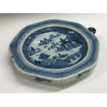 A Chinese porcelain plate of hollow design decorat