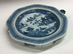 A Chinese porcelain plate of hollow design decorat