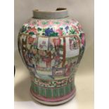 An Antique Chinese Canton vase decorated in bright