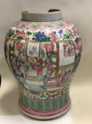 An Antique Chinese Canton vase decorated in bright