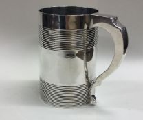 A heavy Georgian silver quart tankard with taperin