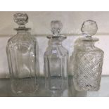 A group of three Georgian style decanters and stop