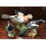 A Beswick figure of a jay together with two others