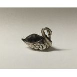 A small silver pin cushion in the form of a swan.