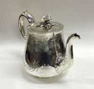 A good engraved silver teapot with flush fitting l