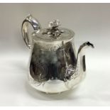 A good engraved silver teapot with flush fitting l
