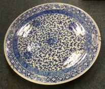 A large Chinese blue and white charger decorated i