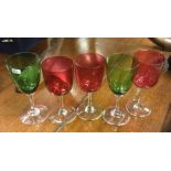 A group of three cranberry drinking glasses togeth