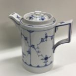 An Antique Chinese blue and white hot water jug. E