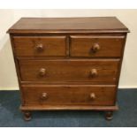 A pine four drawer chest on bun feet. Est. £30 - £