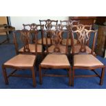 A set of eight Chippendale style dining chairs wit