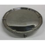 A George III circular silver salver with crested c