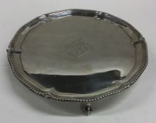 A George III circular silver salver with crested c