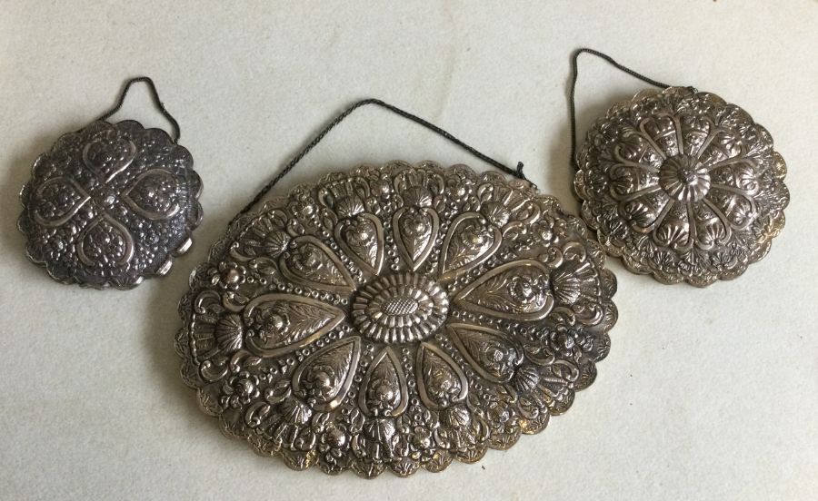 A good set of three Turkish silver mirrors decorate