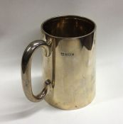 A heavy tapering silver mug. Birmingham. Approx. 3