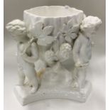 A large white pottery glazed jardinière decorated