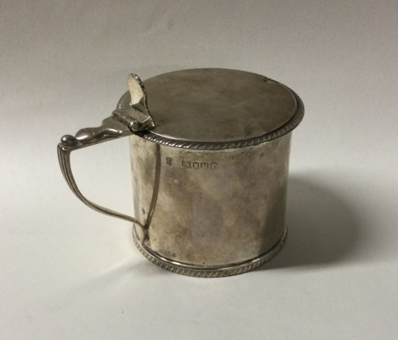 A circular Victorian silver mustard pot with gadro