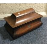 A shaped rosewood mounted tea caddy with hinged li