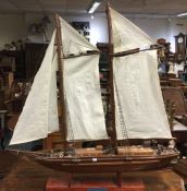 An old wooden pond yacht. Est. £50 - £80.