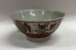 A Chinese baluster shaped bowl decorated in red gr